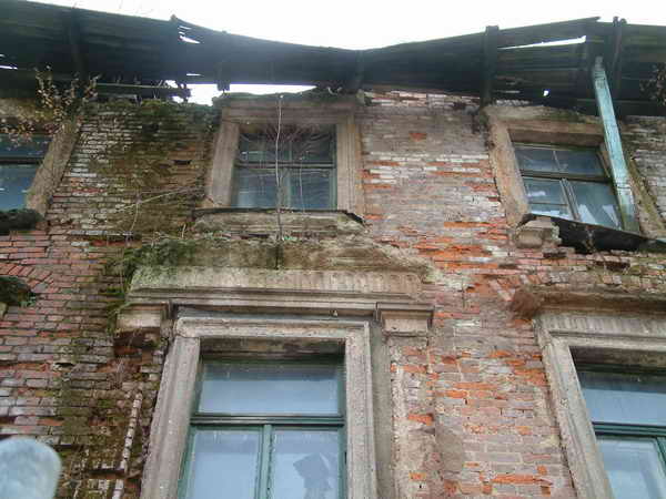 a red bricked building with lots of windows