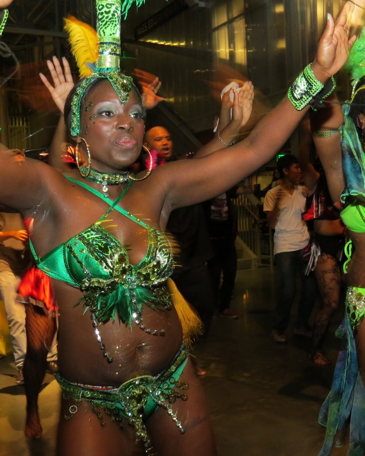 the people are dressed in costume while dancing together