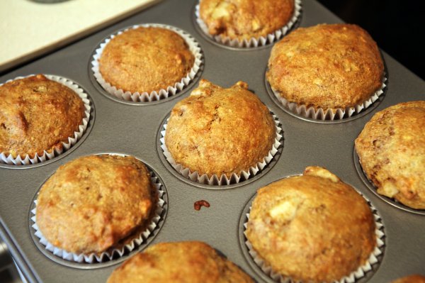 muffins in a pan sitting on a stove