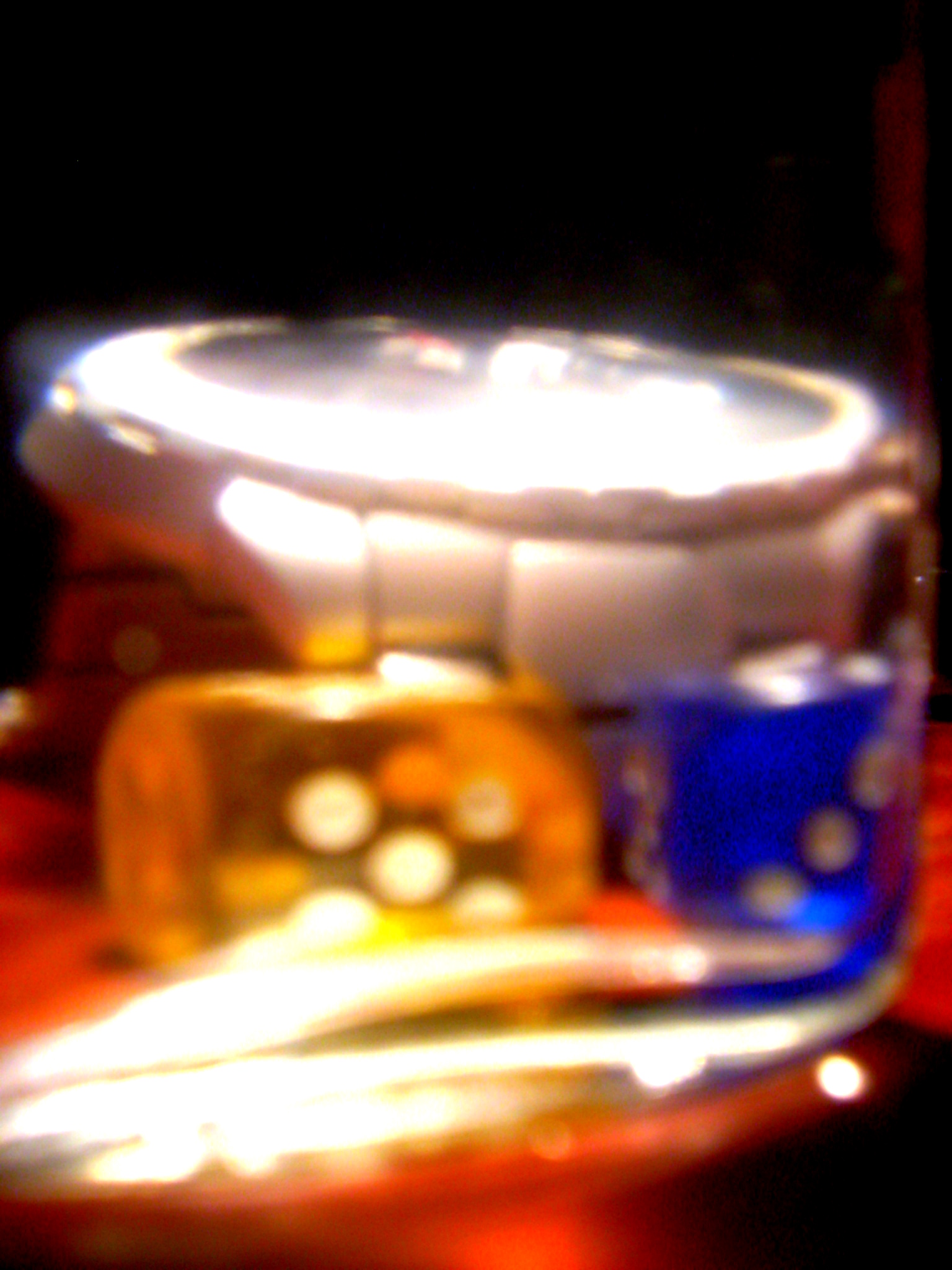 a blurry pograph of some containers and bowls on the counter