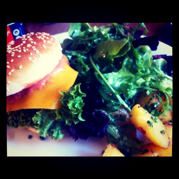 some vegetables and a burger on a plate