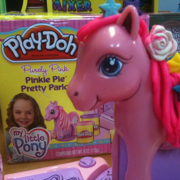 a close up of a toy pony on a table