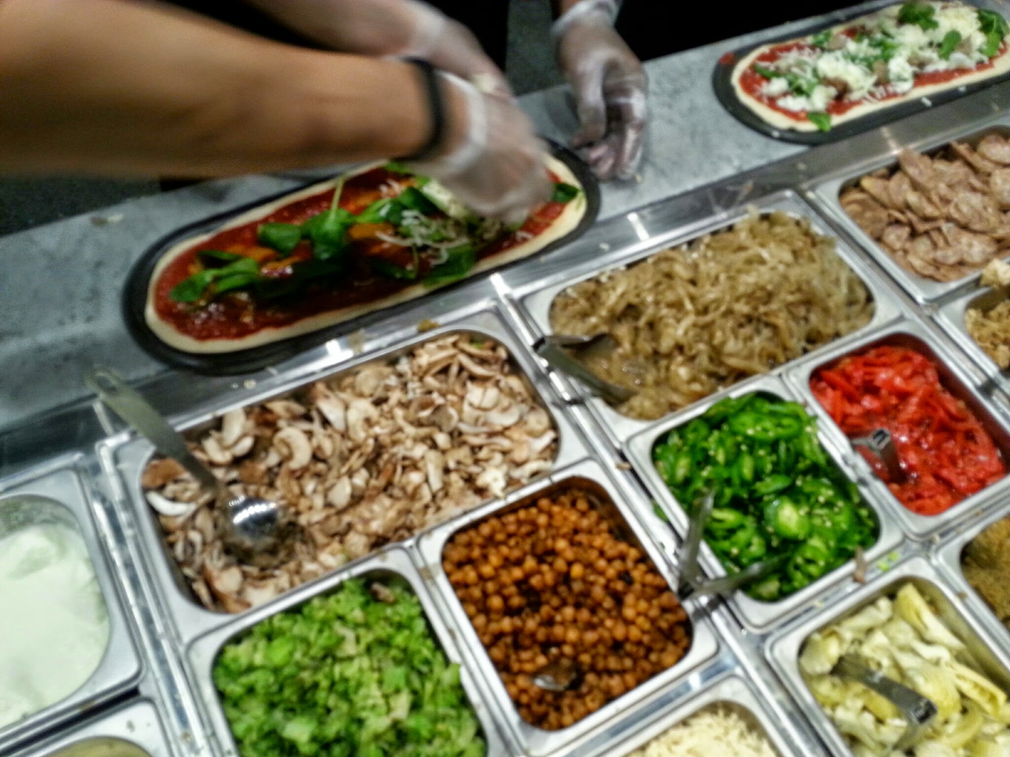 several trays of different kinds of food