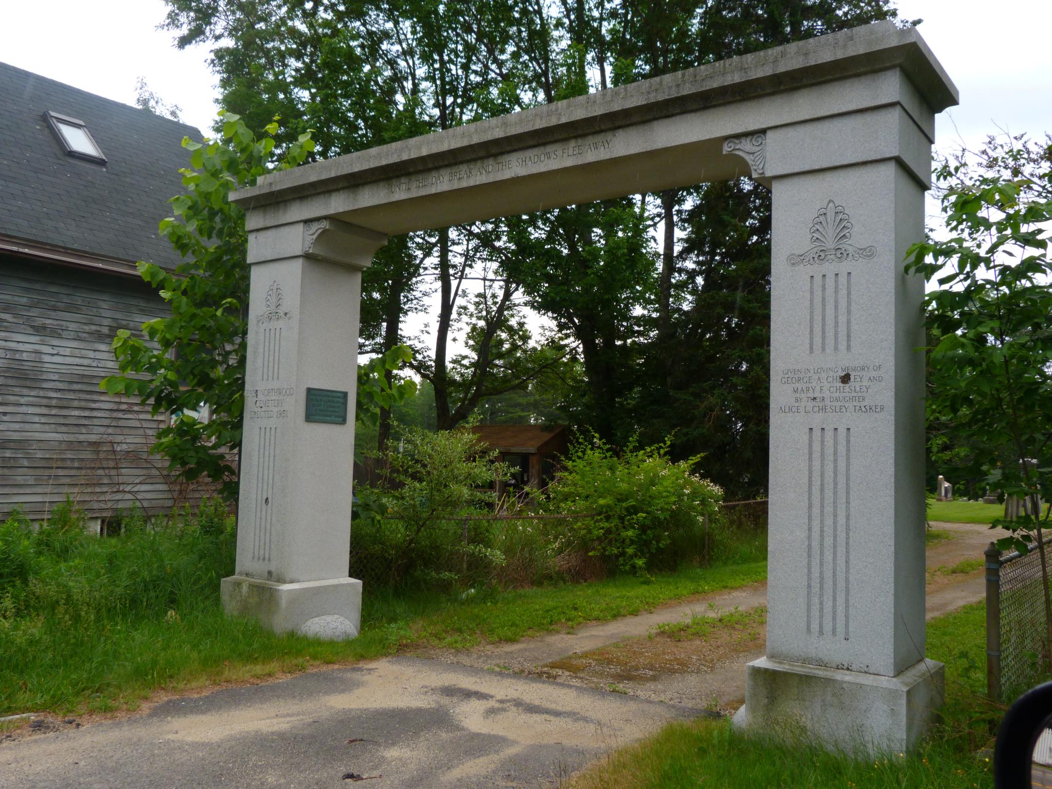 an old archway next to the path