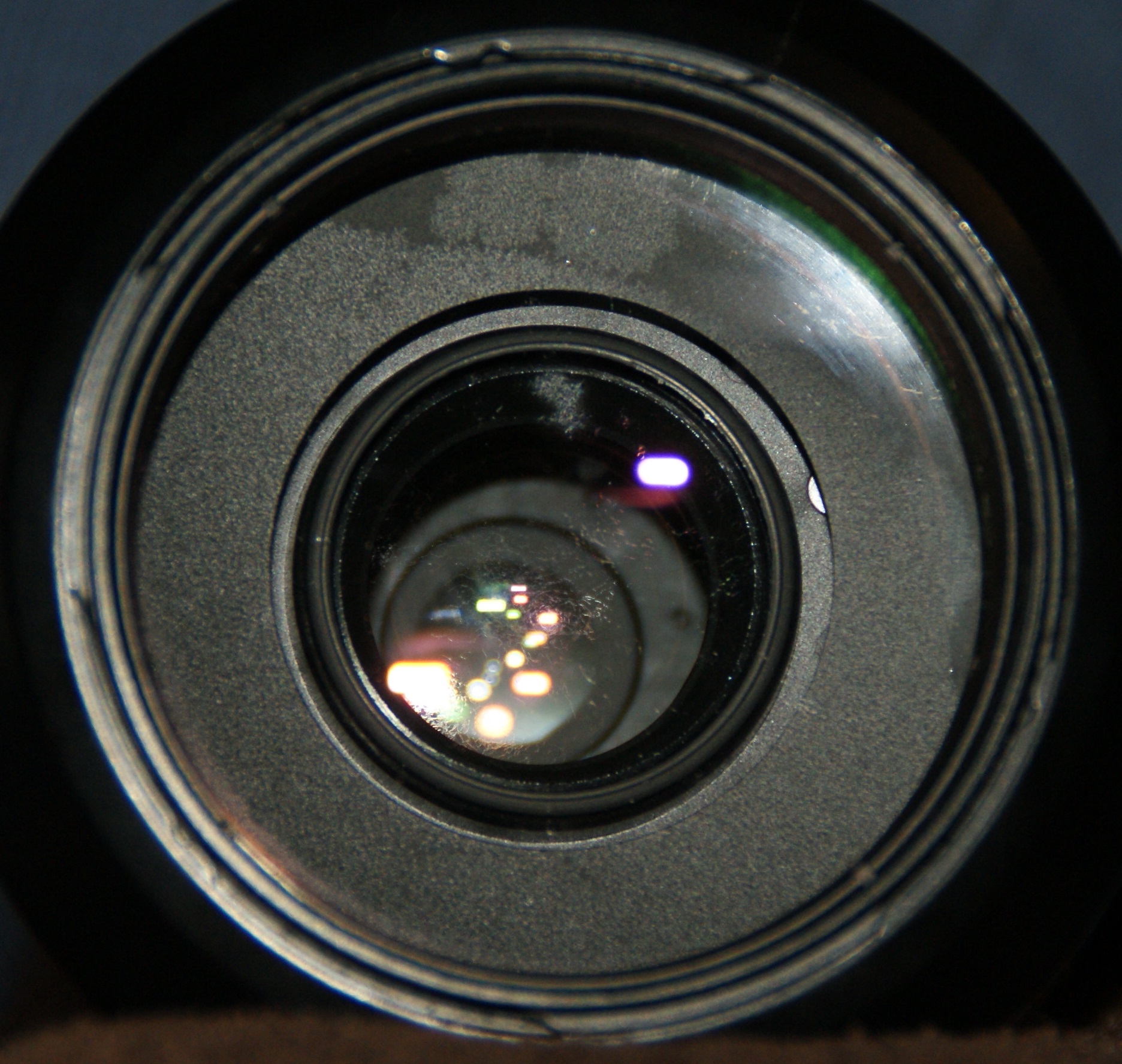 a lens looking down and to the side with small white dots in it