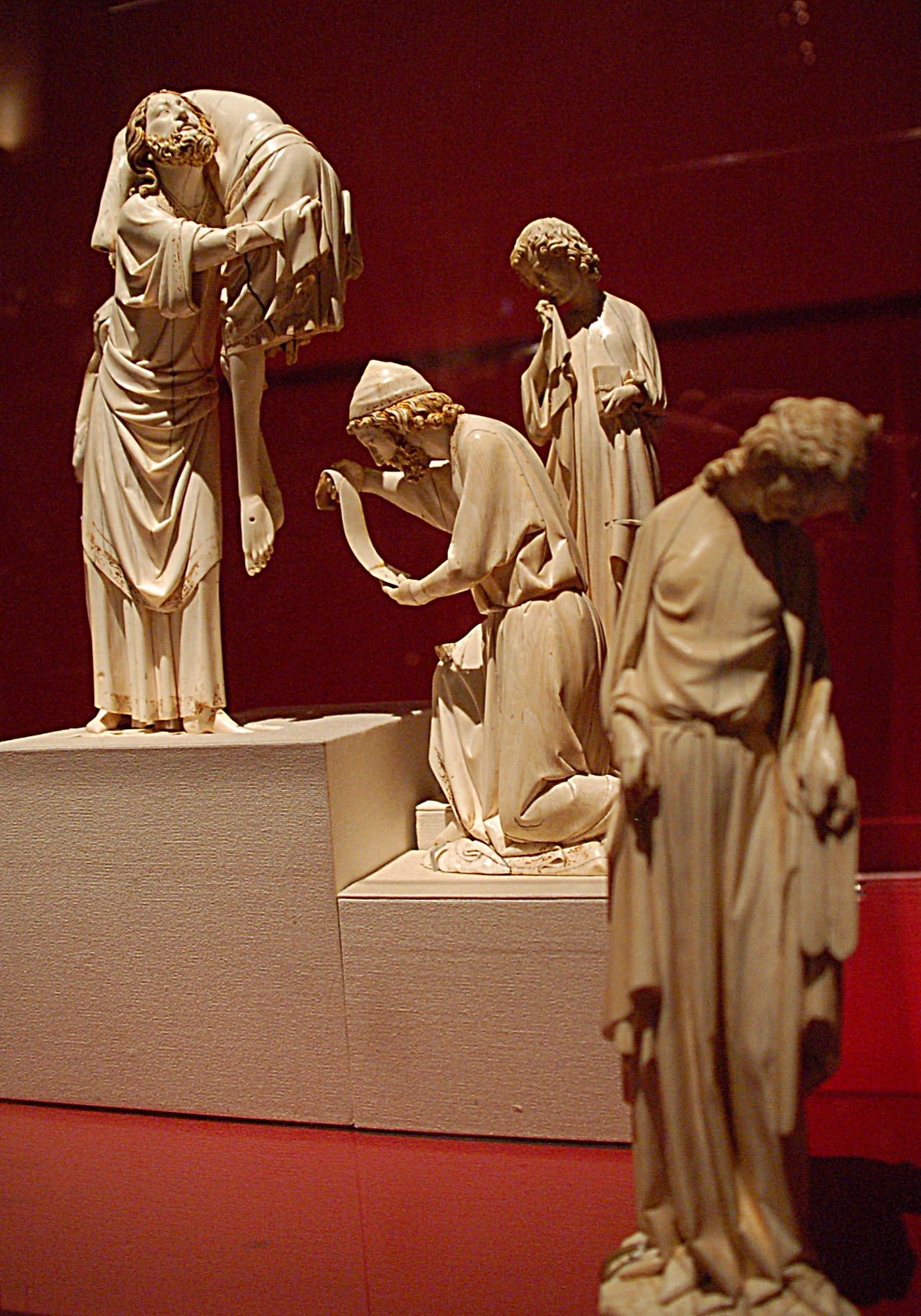 a statue of the three graces on display in a museum