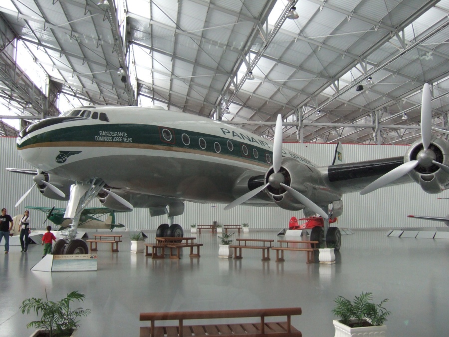 an airplane hanging from the ceiling in a building