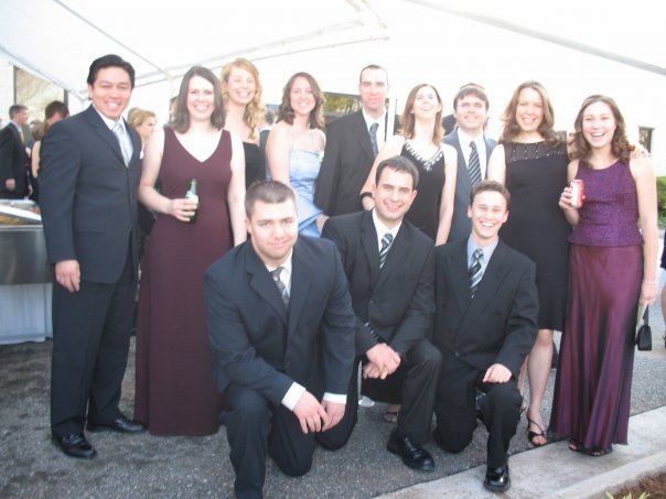 a group of people posing for a po at an event