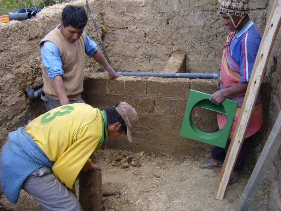 two men and a woman in a construction site