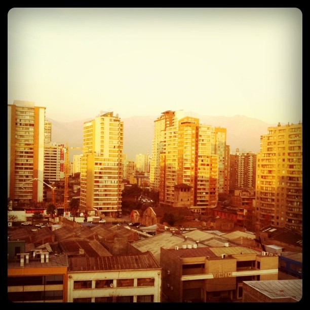 an aerial view of a skyline with many tall buildings in the foreground