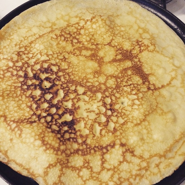 a pan with some pancakes in it on a stove