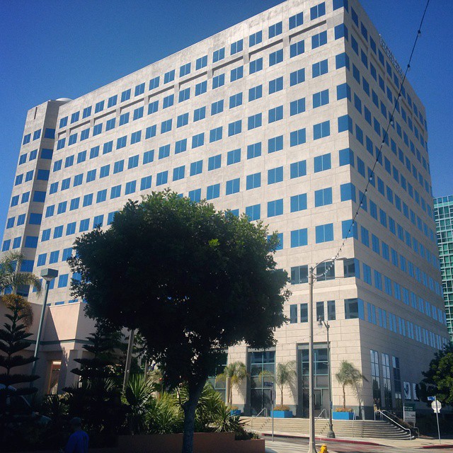an office building with several windows and balconies
