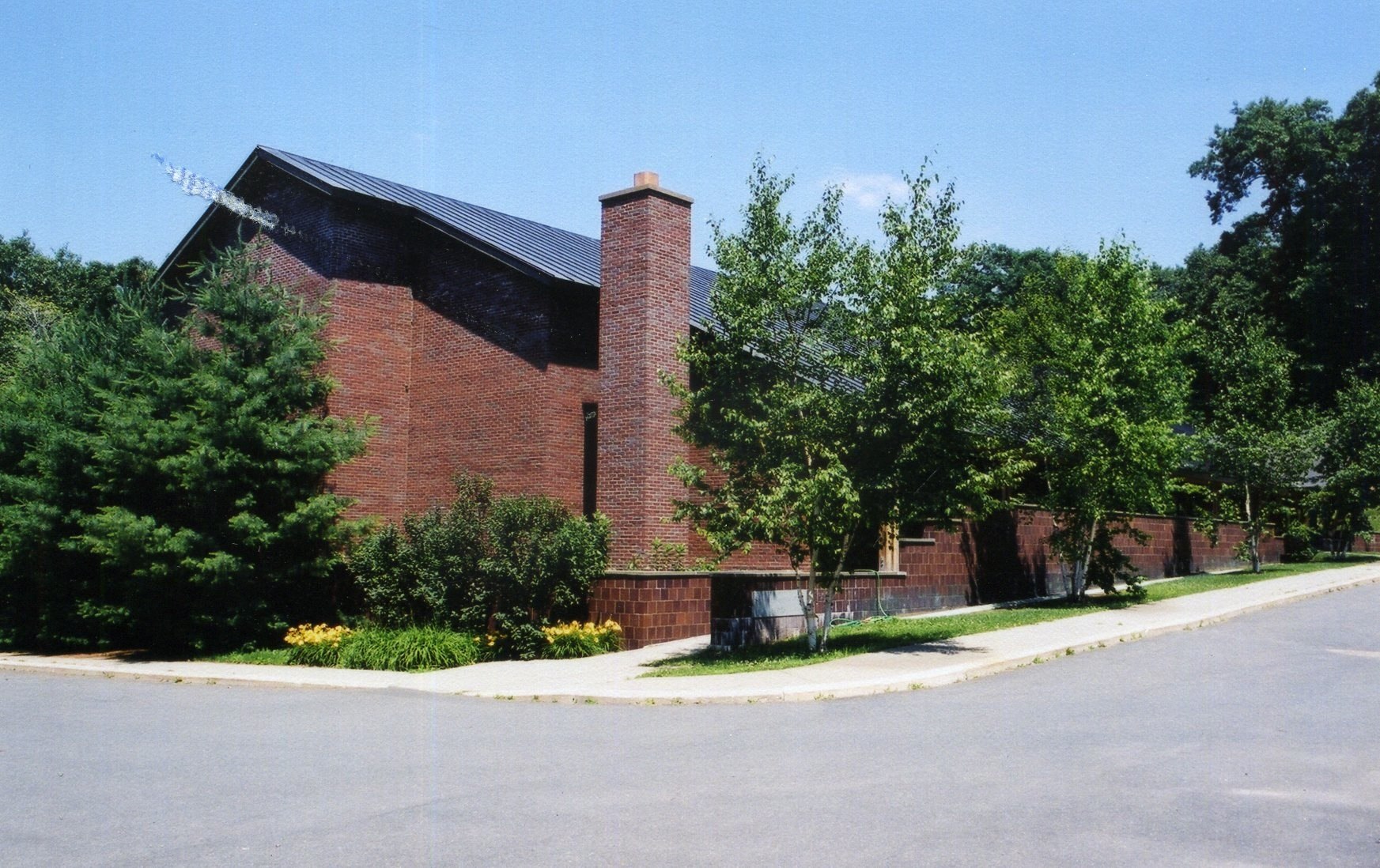 a large brick building sitting on the side of a road