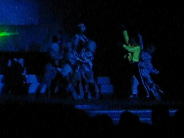 people on stage at night playing music
