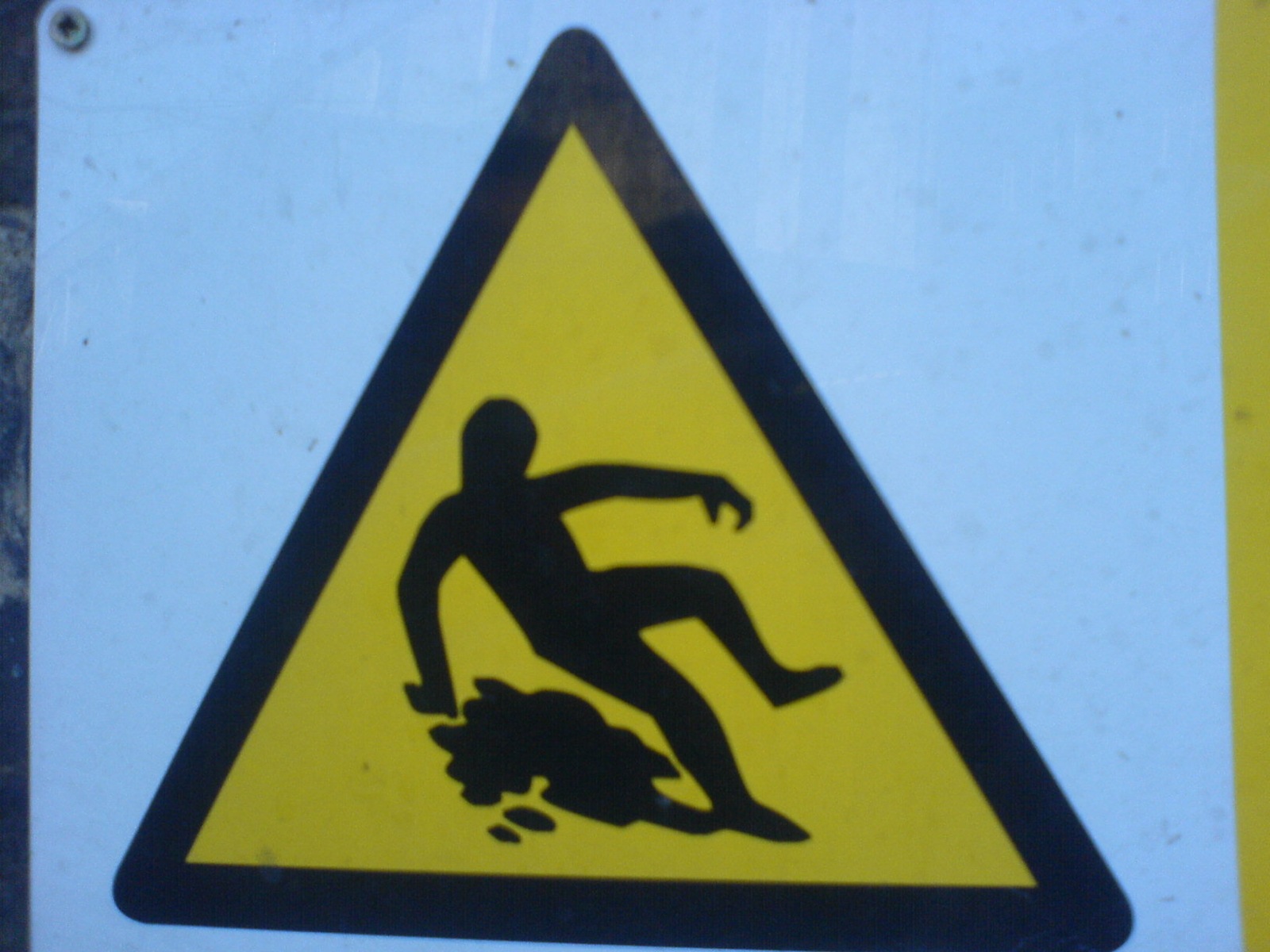 there is a sign showing an upside down picture of a man