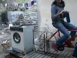 a woman riding a red bike in the city