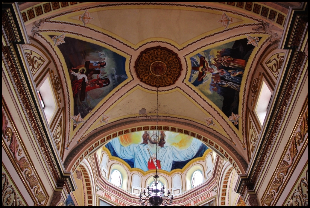 a church with vaulted ceiling and a clock