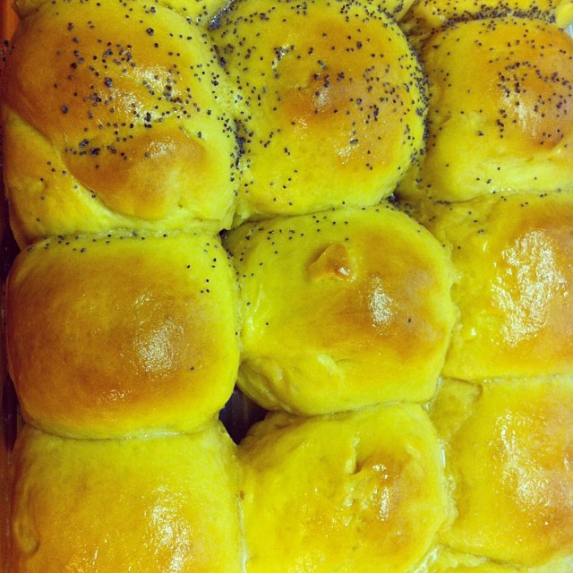 a yellow bread dish covered in lots of yellow items