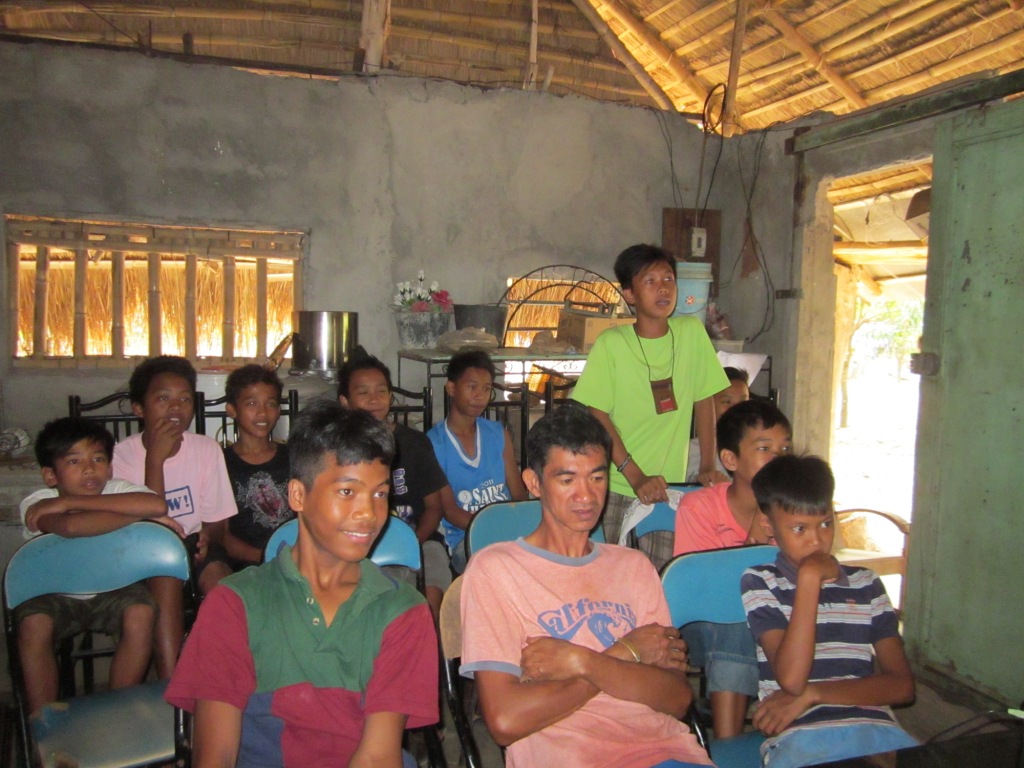 a group of young people sitting next to each other