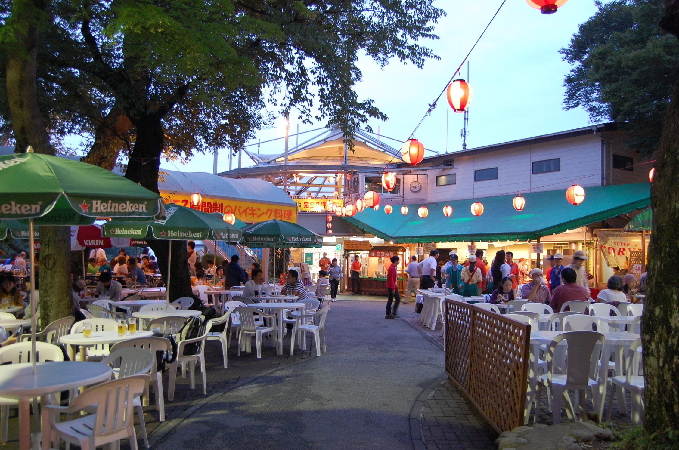 an outdoor market that sells food at night