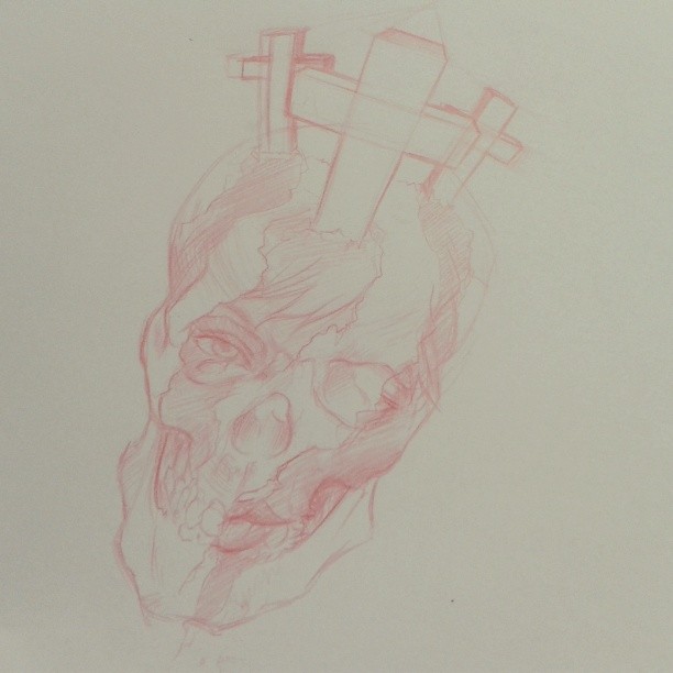the drawing shows a human head in red ink