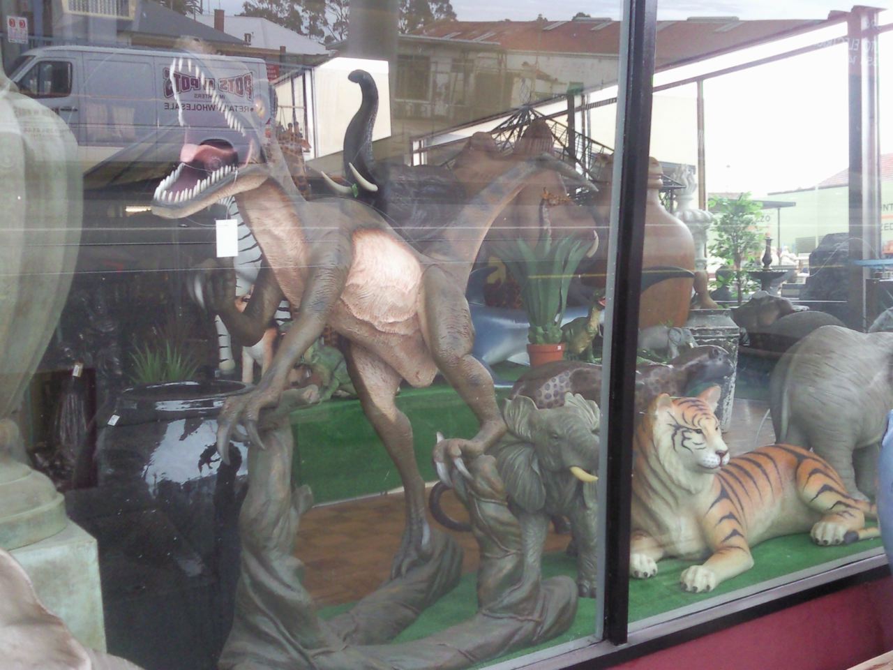 display window of an antique store containing various handic items