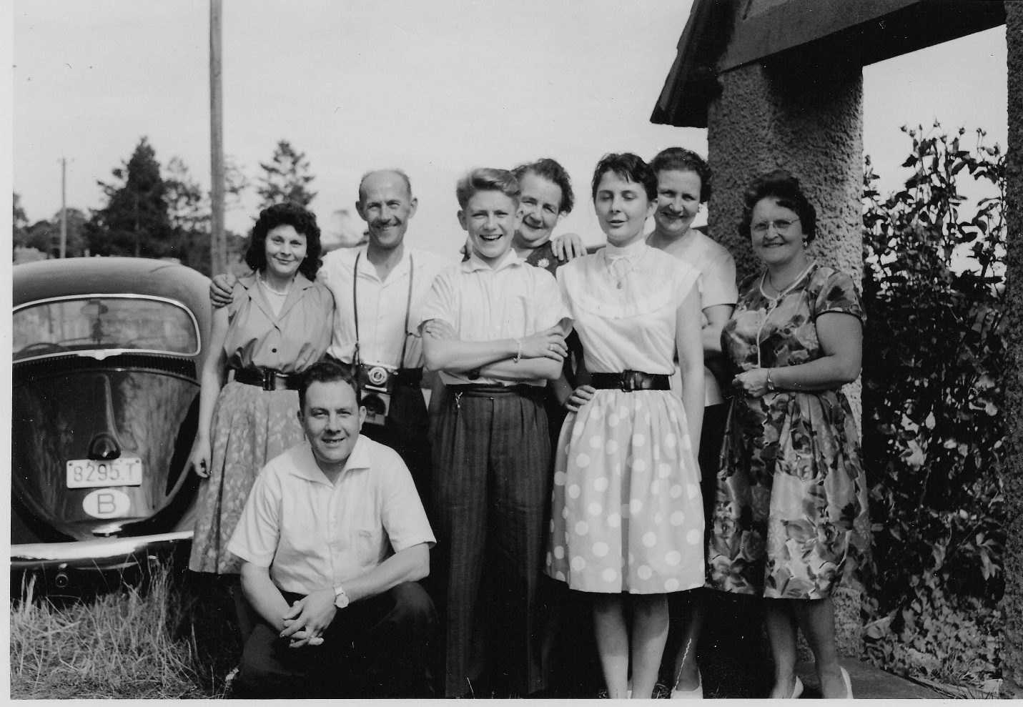an old po of a group of people posing for a po