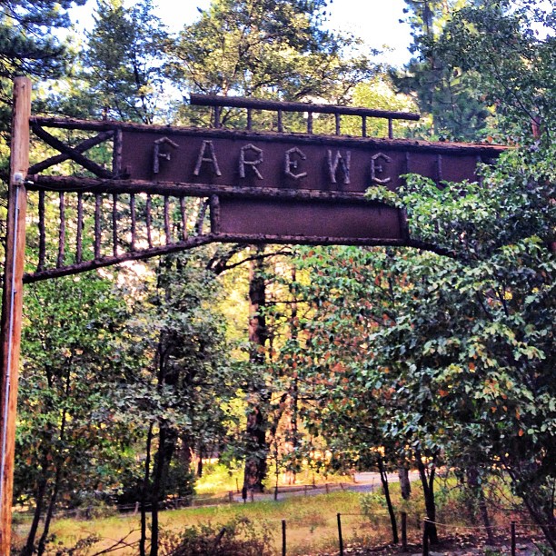 an old rusty sign that says tarrew on it