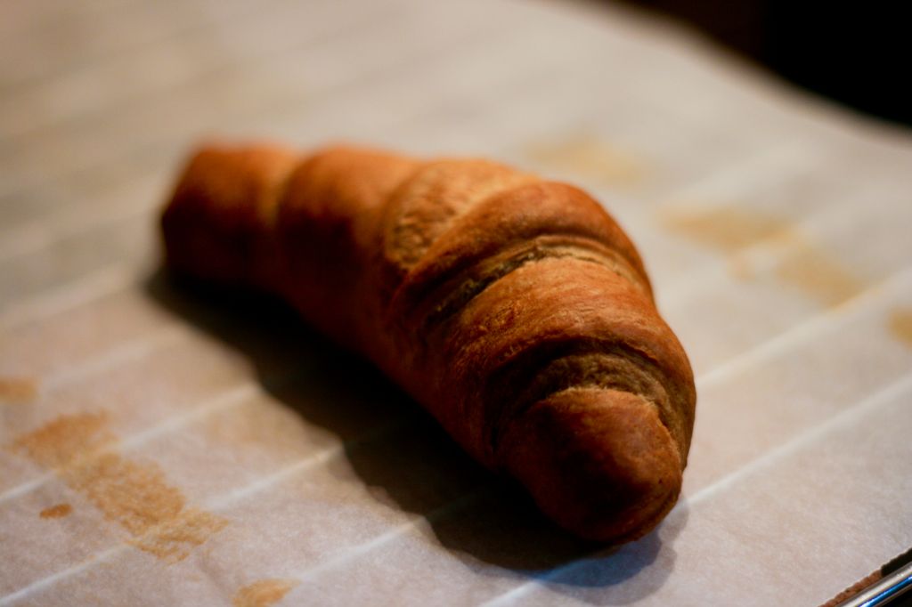 a piece of bread sitting on top of a paper