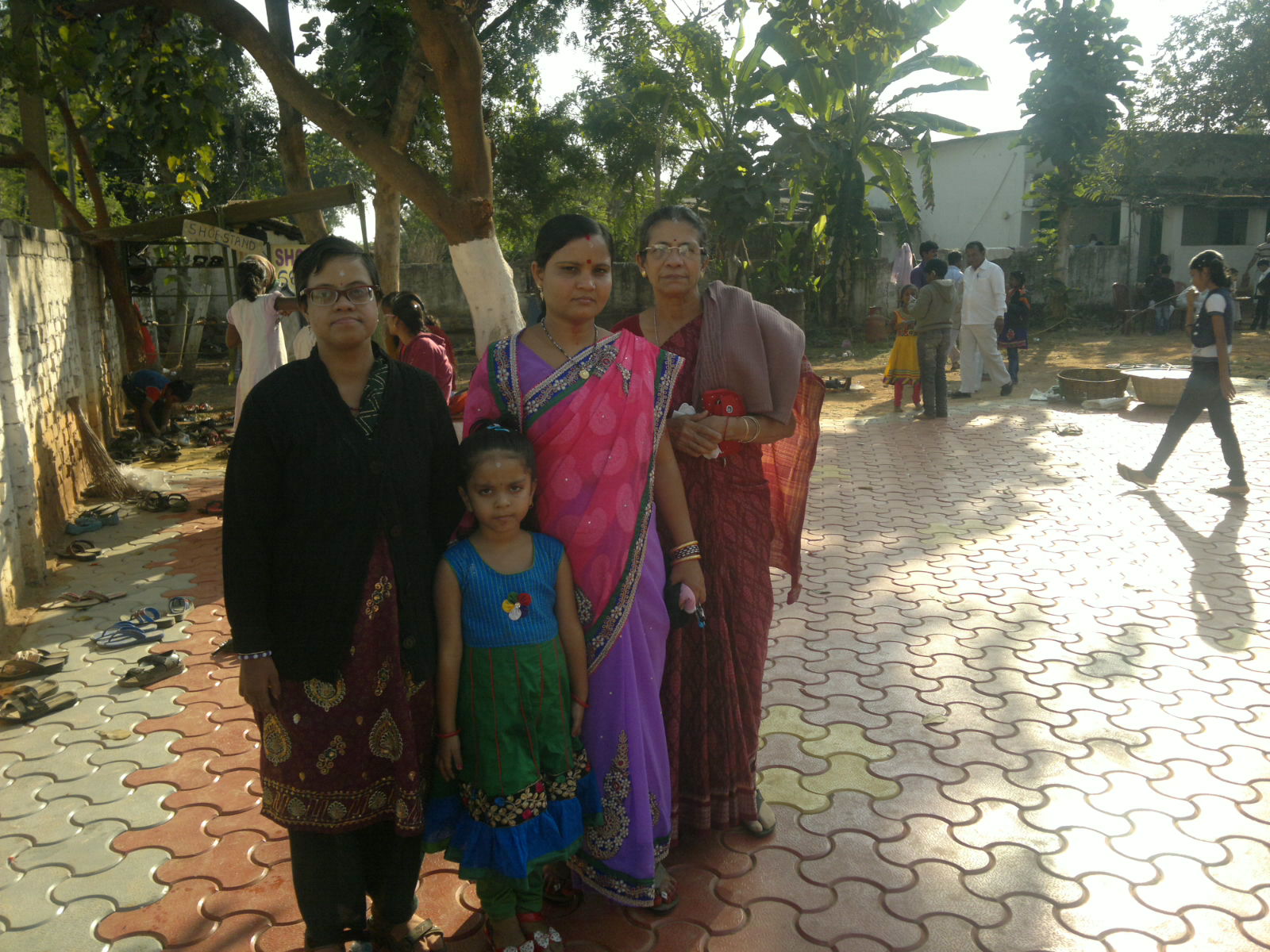 a woman and two children standing next to each other