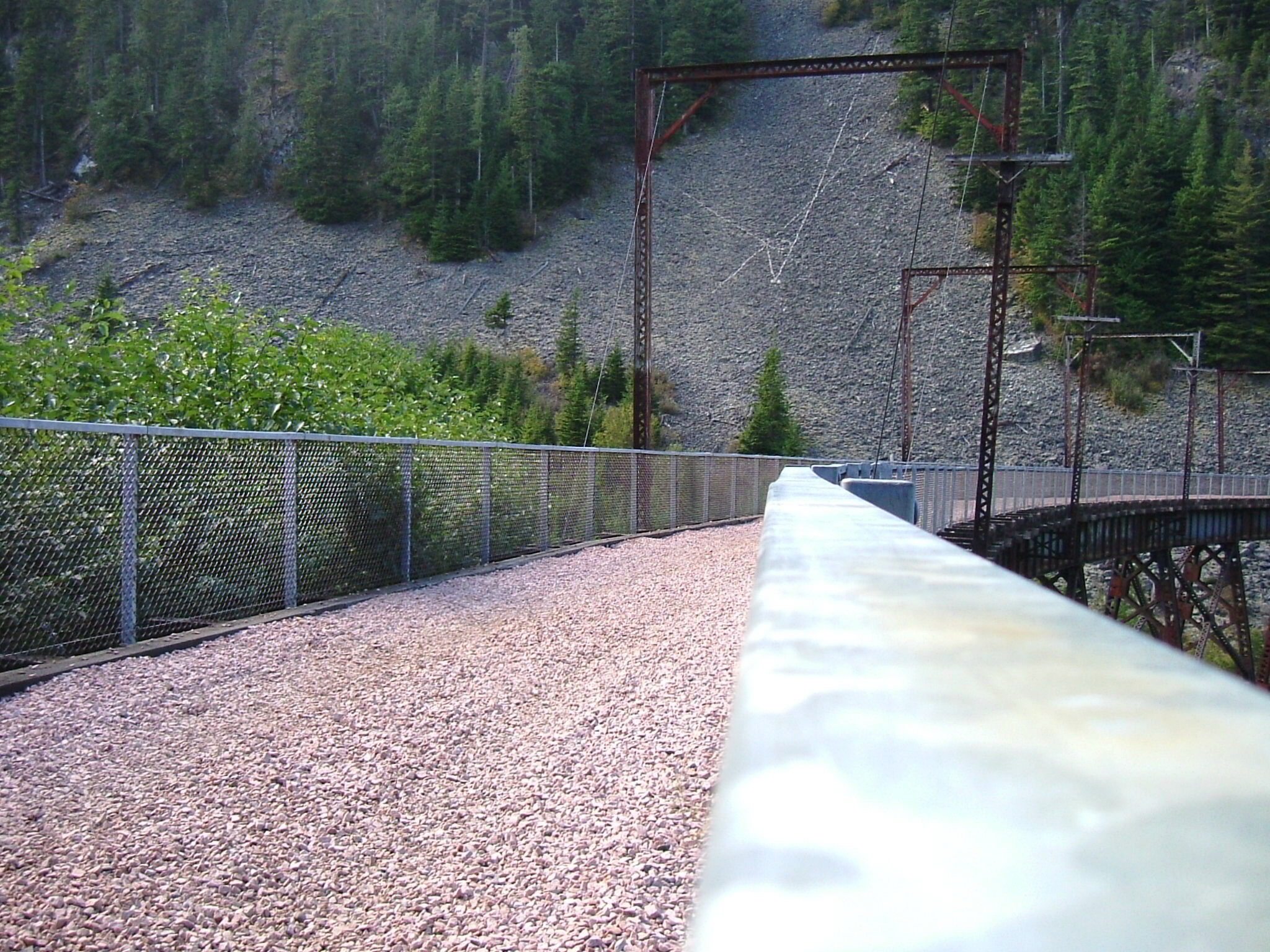 the trail goes over the hill to the river