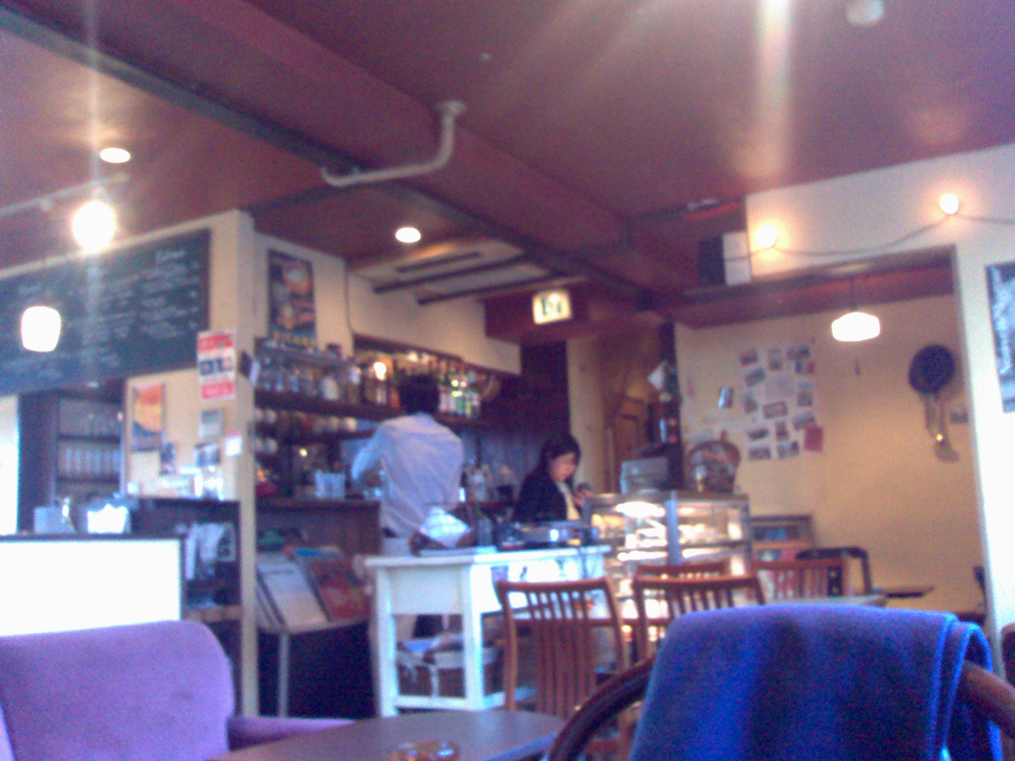 a restaurant with a purple chair and tables