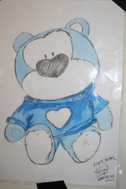 a blue and white drawing of a teddy bear with a shirt