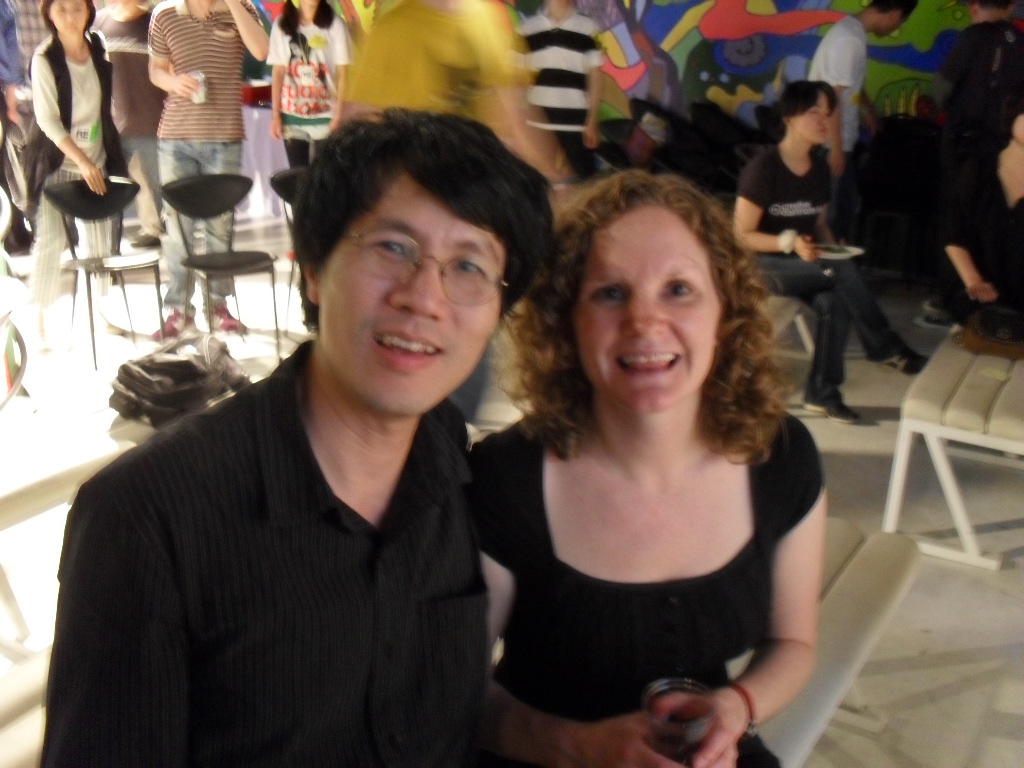 two people are posing for the camera at an event