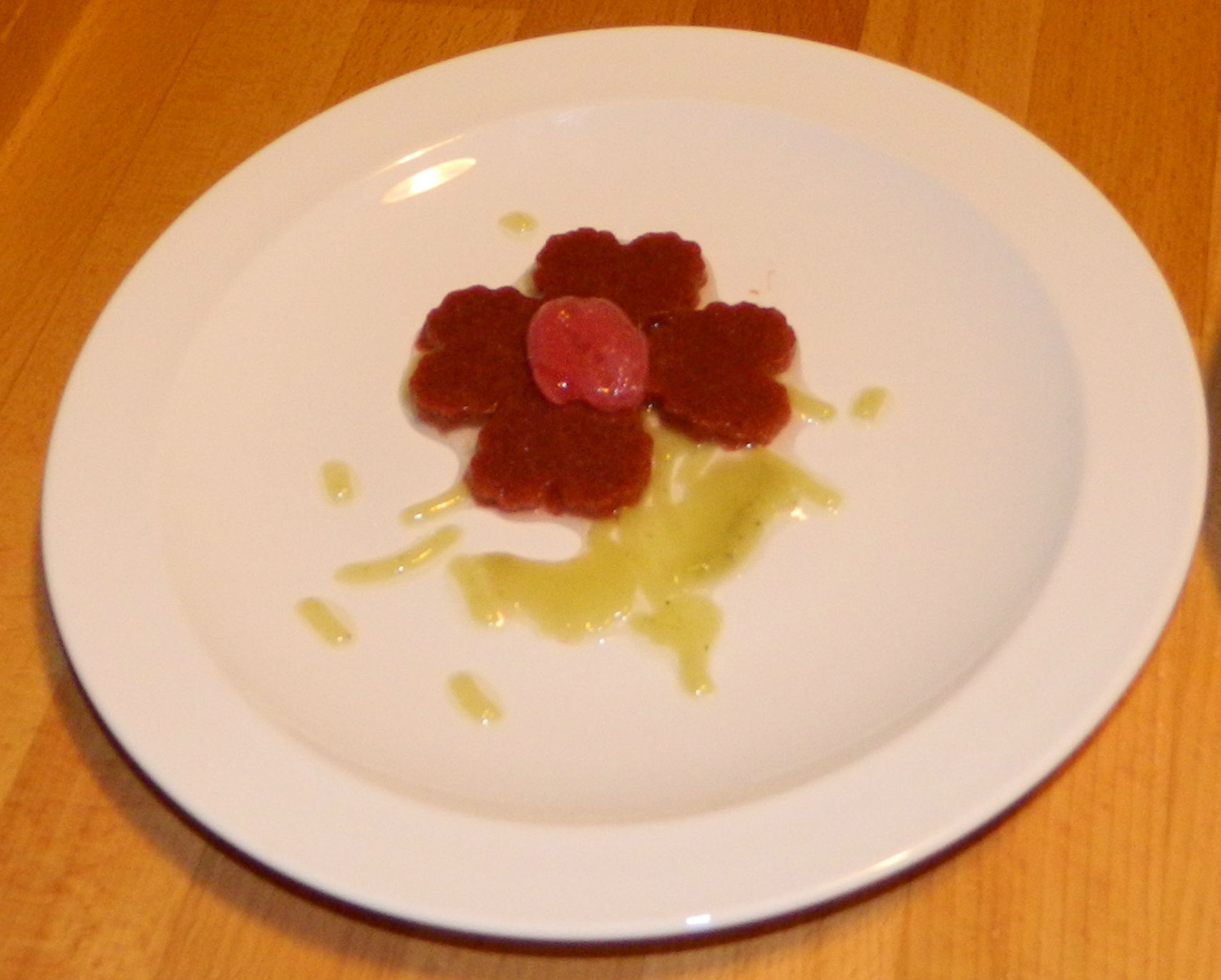 a plate with some kind of fruit dessert on it