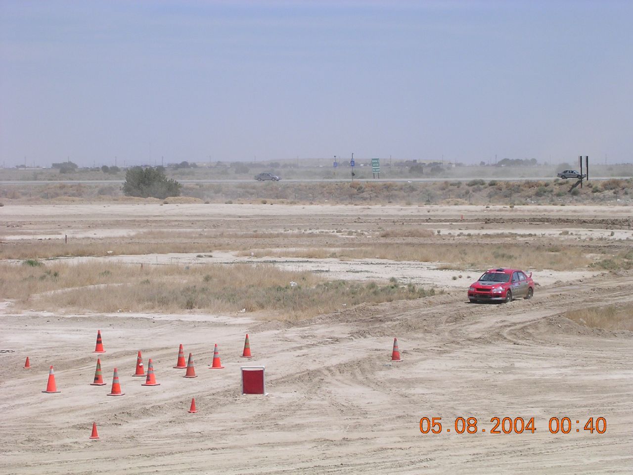 a car that is driving on a dirt road