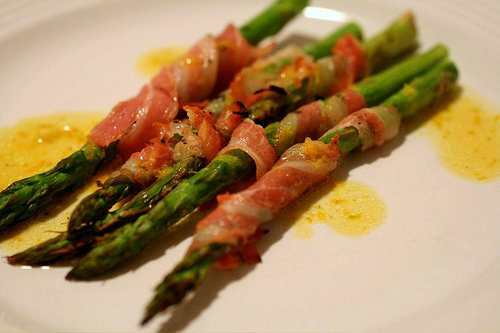 asparagus spears on a plate with other foods