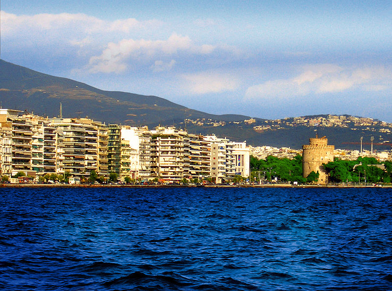 several high rise buildings line the shoreline of a city