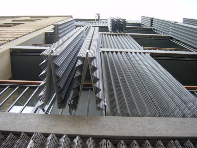 a tall building with lots of steel slats
