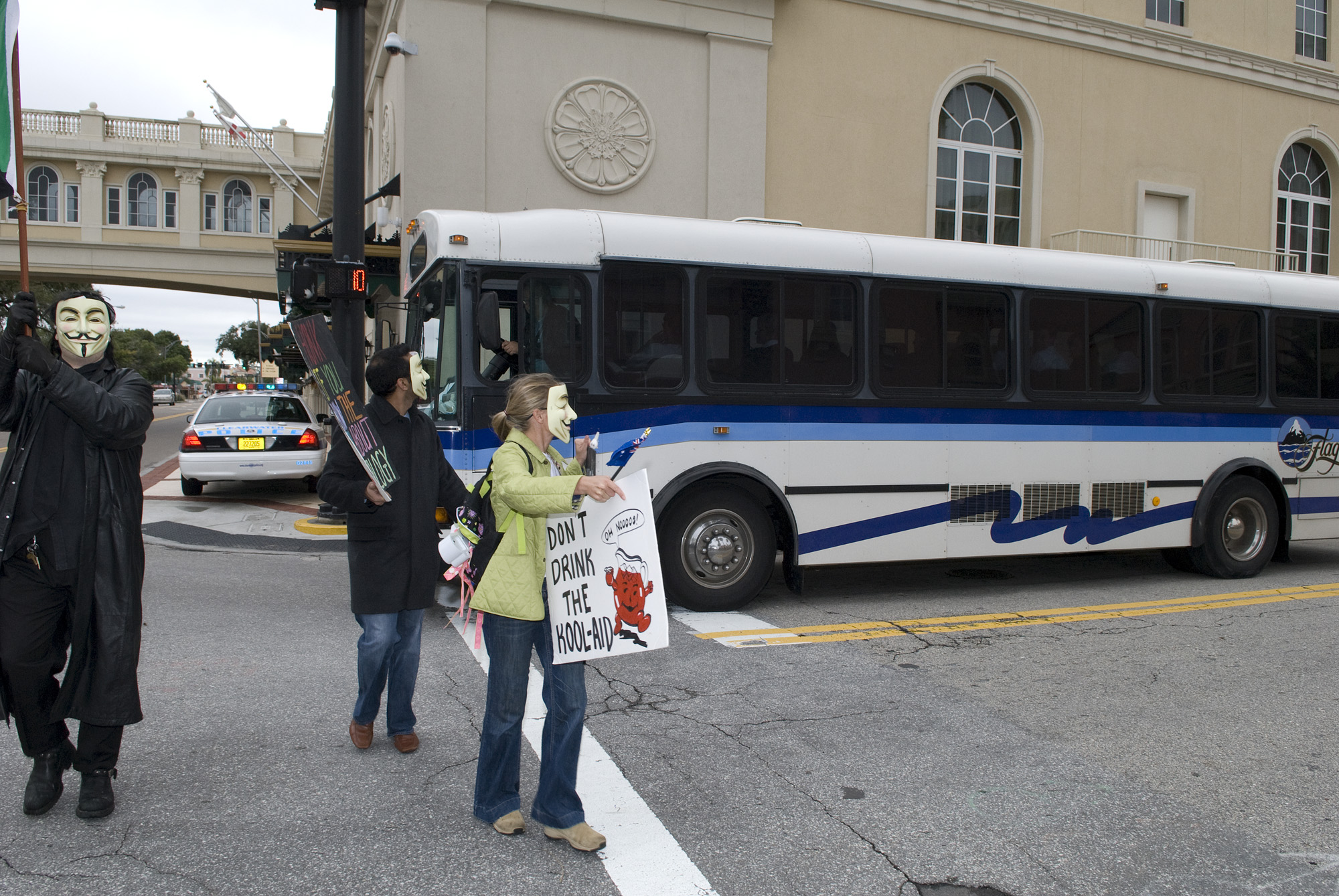 a bus in front of a building holding a sign saying, i have no intention