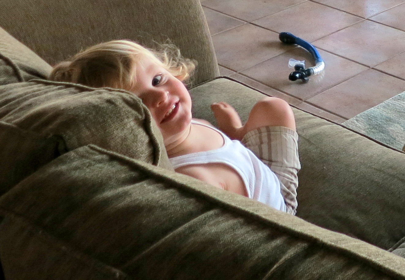 a  playing with a remote control in her hand
