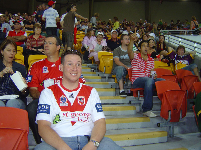 several fans watch an oncoming football match