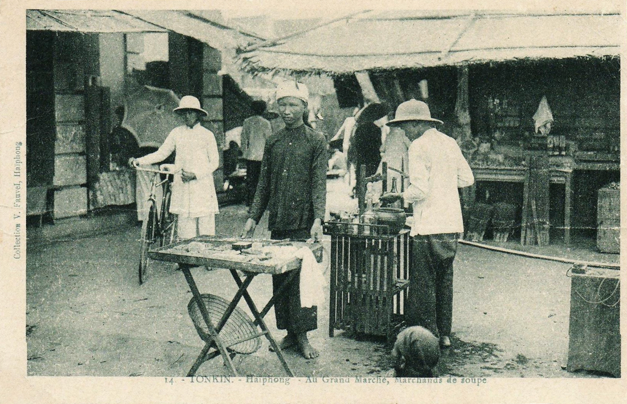 a black and white po shows people on a farm