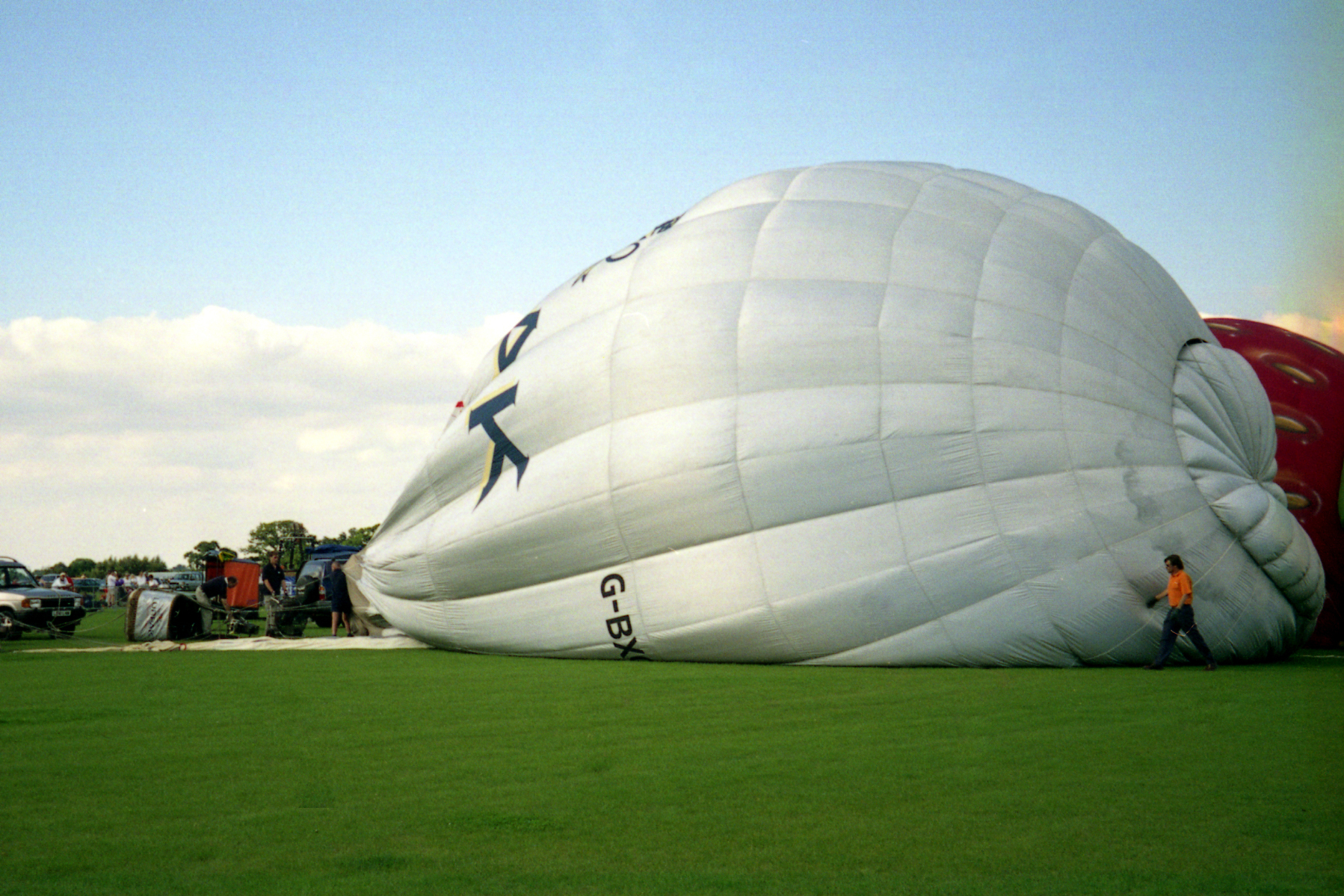 a big white balloon with an airplane on top