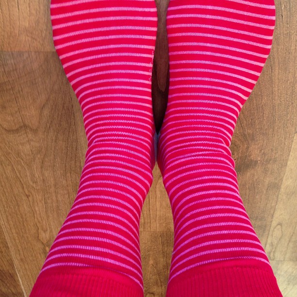 a close - up of someone's feet with red socks