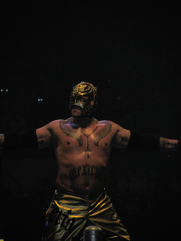 a wrestler with  standing in the dark
