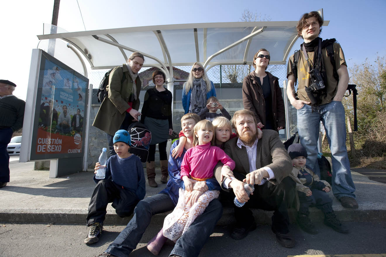 there are many children sitting on steps together