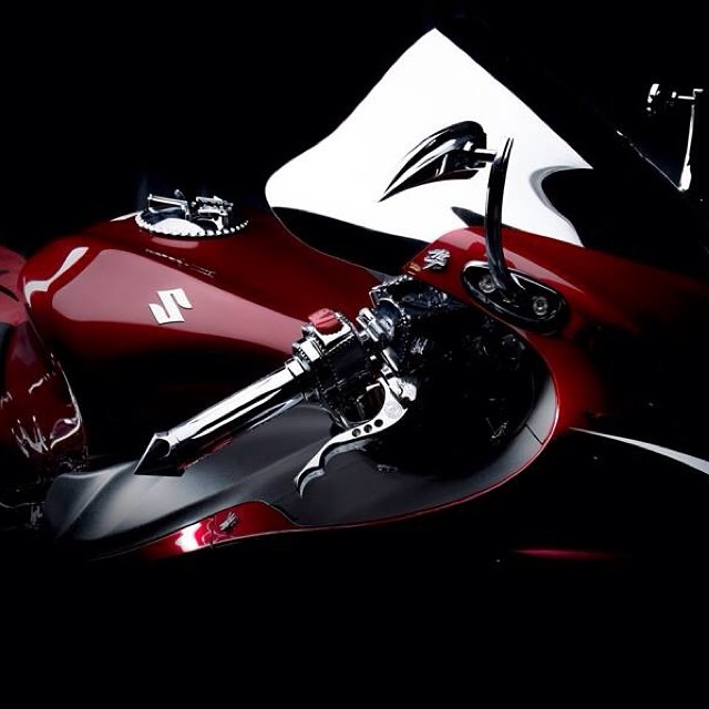 the front end of a red motorcycle on display