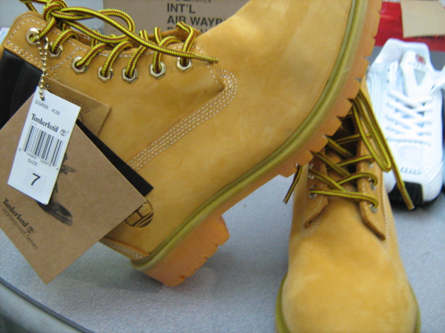 yellow timber boots sitting on top of a table