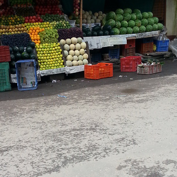 a bunch of different fruits on a street